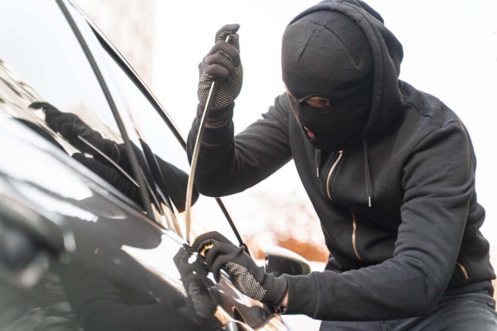 close-up-man-trying-break-into-car